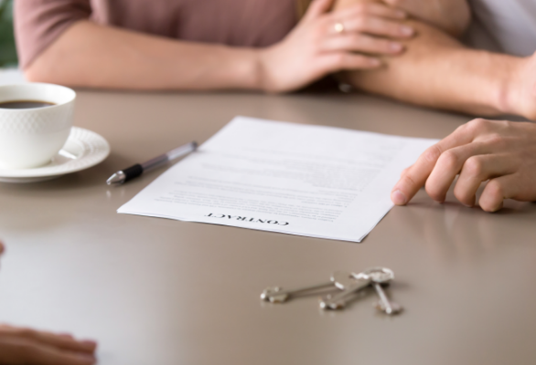 closeup-contract-table-couple-taking-mortgage-loan