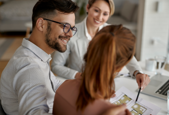 young-happy-couple-their-real-estate-agent-having-meeting-office-focus-is-man